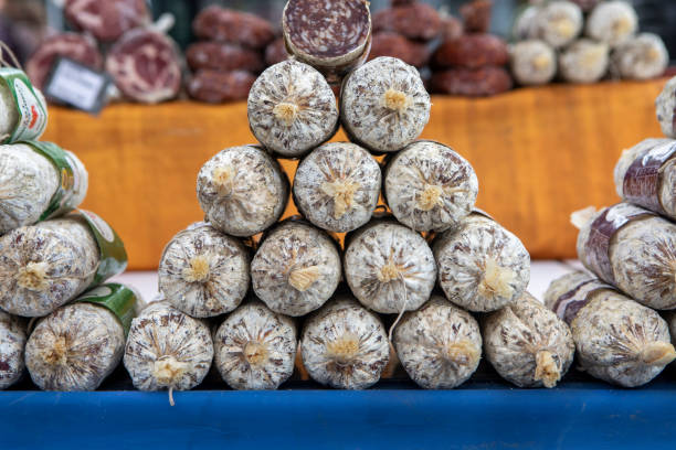 istock Stack of salami on a market stall 1494509823