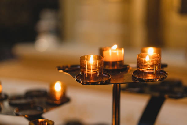 istock Many Candles burning in a cathedral. 1494510610
