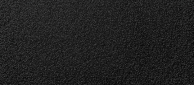 smooth black plastic porous grainy pattern surface for background