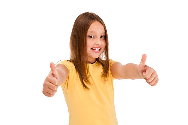 Young girl showing OK sign isolated on white