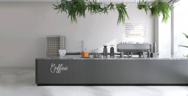 istock Minimal, luxury design cafe, gray wood panel counter front with espresso machine, cake display, coffee grinder, cup, tropical green foliage of fern hanging from ceiling in sunlight on white wall 1494513619