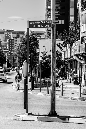 Pristina – July 16, 2022: A junction with traffic lights at Bill Clinton Boulevard, a main street in the city of Pristina, Kosovo, Former Yugoslavia. On a sunny summer day.