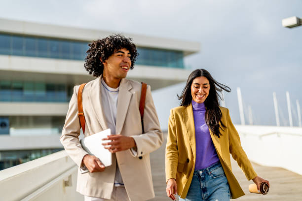 istock Two business people walking and talking during coffee break 1494515184