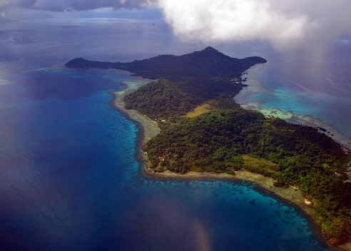 Chuuk / Truk lagoon, Chuuk State, Federated States of Micronesia (FSM): aerial view of the hilly and densely forested Udot island, with Romonum Island in background (part of the Faichuk Islands) - located in Chuuk lagoon, southwest of Weno island.