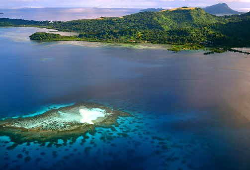 Weno Island, Chuuk / Truk State, Federated States of Micronesia (FSM): aerial view of a reef and sandbank in Chuuk lagoon, located between the airport and Fono islet with the hills of Weno's northeast coast at the top.