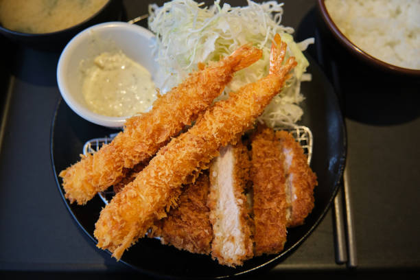 istock Tonkatsu set with panko breaded deep fried prawn with shredded cabbage. 1494518134