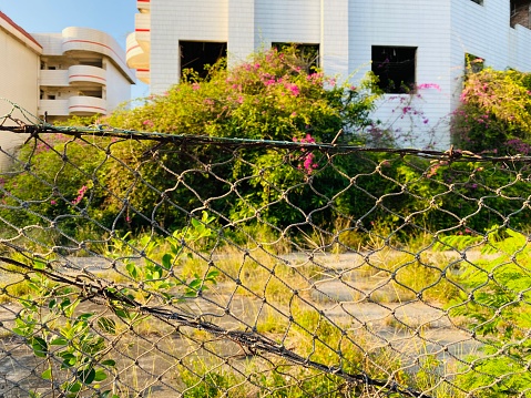 Wire fence around the abandoned building