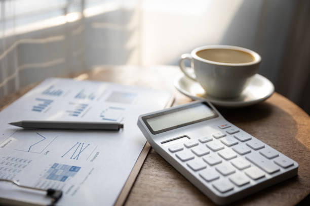 istock Start your working day with hot latte coffee cup background, laptop and mobile phone at work. 1494521579
