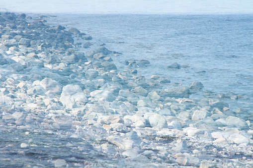 Creative dreamlike image of rocks by the sea