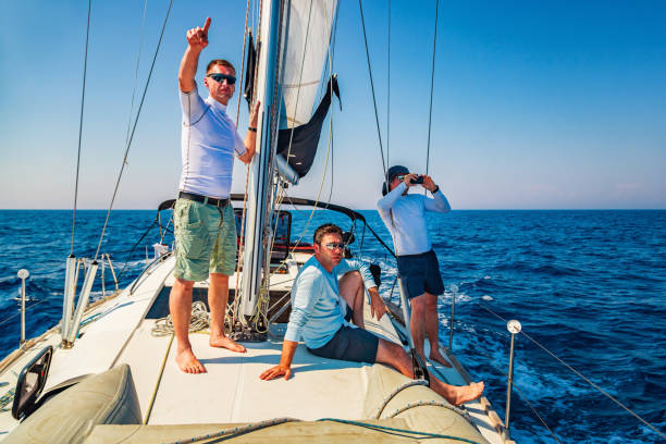 istock Crew members observing island Palagruza from sailboat 1494524706