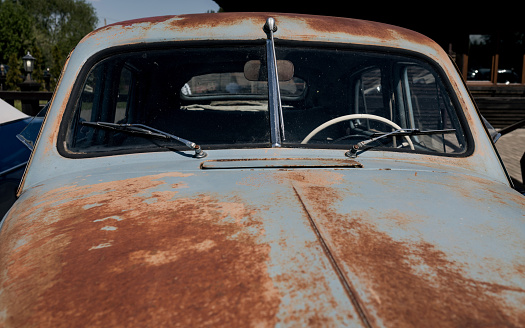 hood of a vintage rusty car.  old-fashioned automobile