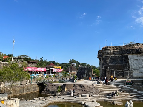 Yogyakarta, Indonesia - May 30, 2023: Tourism area around Tebing Breksi or Breksi Cliff which is a former limestone mining area that transformed into a tourism area with many facility