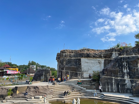 Yogyakarta, Indonesia - May 30, 2023: Tourism area around Tebing Breksi or Breksi Cliff which is a former limestone mining area that transformed into a tourism area with many facility