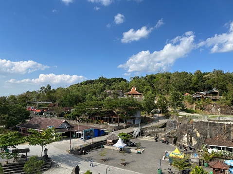 Yogyakarta, Indonesia - May 30, 2023: Tourism area around Tebing Breksi or Breksi Cliff which is a former limestone mining area that transformed into a tourism area with many facility