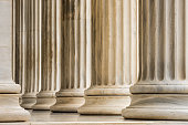 Architectural detail of Ionic order marble columns in a row