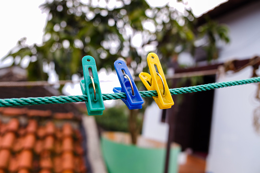 three clothespins on the clothesline