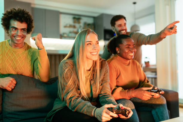 istock Two diverse couples playing video games and having fun at home 1494530977