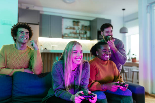 istock Two diverse couples playing video games and having fun at home 1494531582
