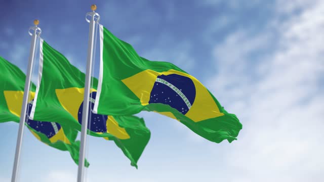 Seamless loop in slow motion of Three Brazil national flags waving