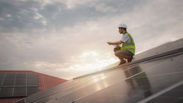 istock Service engineer checking solar cell on the roof for maintenance if there is a damaged part. Engineer worker install solar panel. Clean energy concept. 1494534047