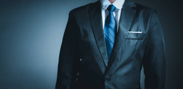 istock businessman standing on dark gradient background. business concept. suit. 1494534150