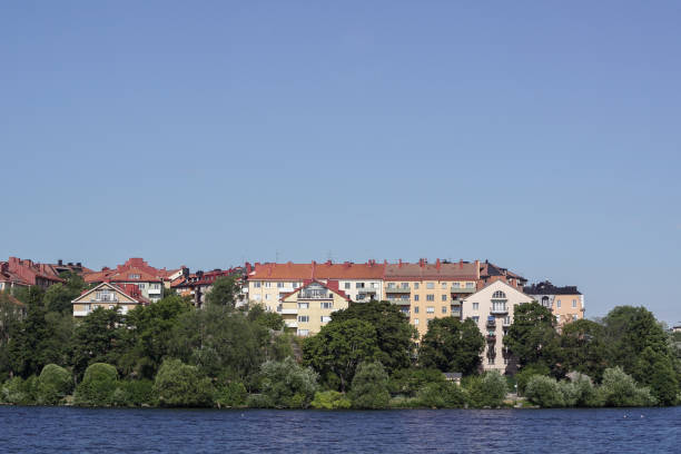 istock Scenic view of river by buildings against clear blue sky 1494534413