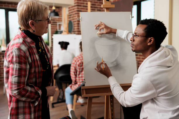 istock Senior woman taking up drawing class 1494535034