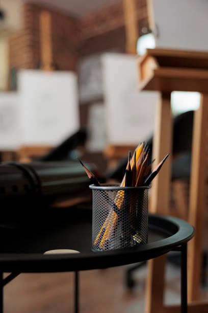 Defocused shot of a woman using coloring pencils in a jar