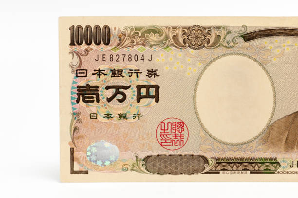 istock Front view of 10000 yen note in close-up isolated on white background 1494539302