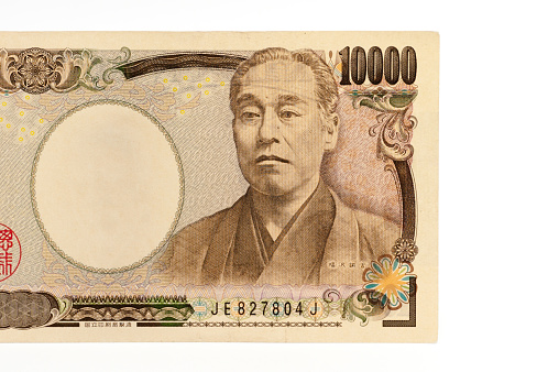 Front view of 10000 yen note in close-up isolated on white background.