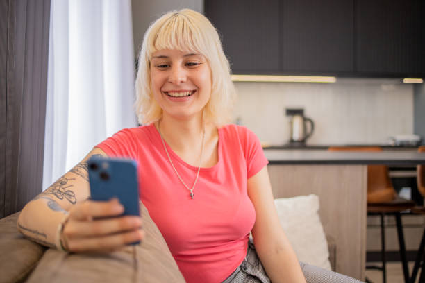 istock Happy young woman using phone 1494540637