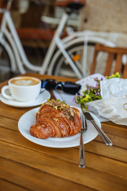 istock With croissants and coffee on the cafe's summer terrace 1494541116