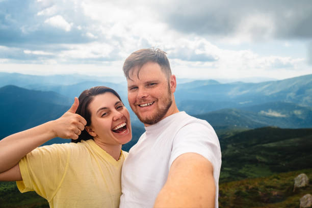 istock A happy couple on the mountain 1494541130