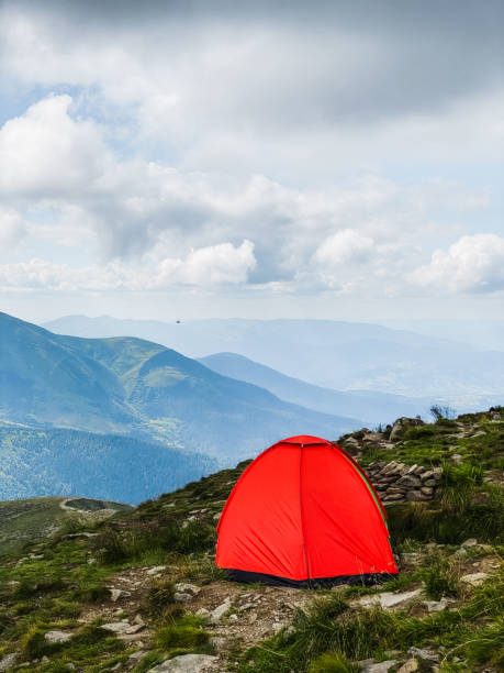 istock Bright tent on the top of the mountain 1494541132