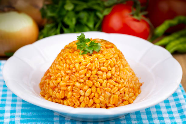 istock Traditional turkish bulgur pilaf with tomato sause in plate (Turkish name; meyhane pilavi) 1494545031