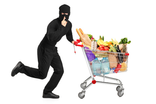 Robber stealing a pushcart with products, isolated on white 