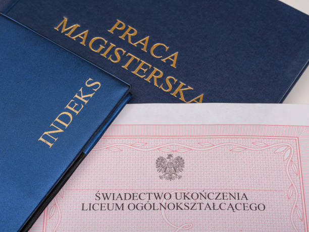 istock A high school graduation certificate lying next to the student's record books and the master's thesis 1494554652