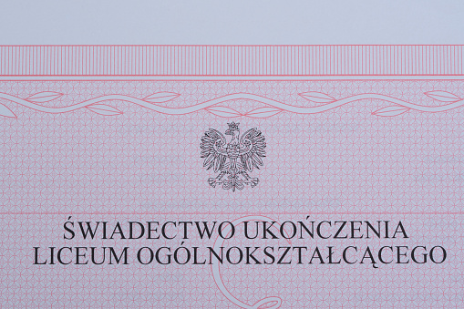 A school diploma in Poland with the Polish emblem - the eagle.  translation of the inscription \