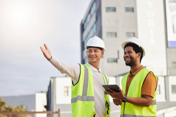 istock Tablet, teamwork or architecture with an engineer man and designer planning on a construction site. Architect, building and collaboration with men working together to design a development project 1494557570