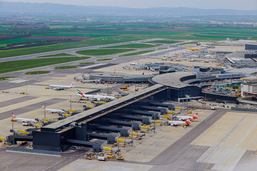 MAY 27 2023 Vienna Austria. Aerial view of parking area and terminal at international airport of VIE
