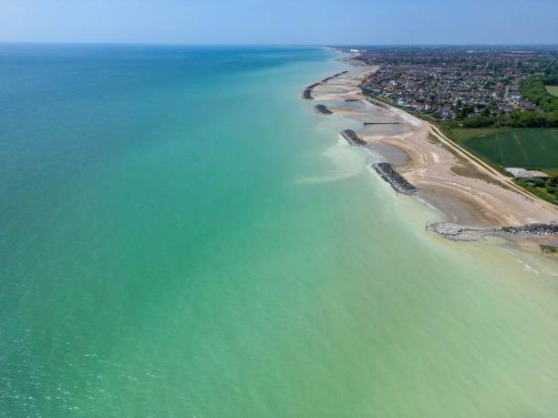 istock Aerial view of an unoccupied beach with a tranquil blue sky above 1494559599