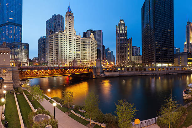 Chicago Riverside. Image of the Chicago riverside downtown district during sunset blue hour. tribune tower stock pictures, royalty-free photos & images