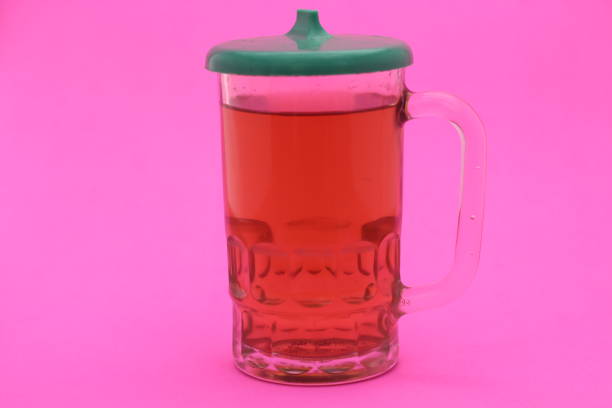 glass of hot tea isolated on pink background