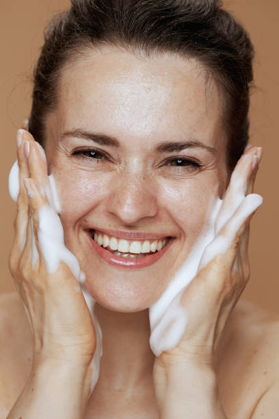 istock smiling modern woman washing face 1494563603