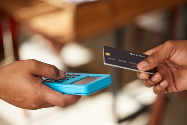 istock Credit card, hands and payment on pos machine for fintech, banking or ecommerce. Digital technology, point of sales and man or customer buying, paying or tap on device for retail shopping or b2c. 1494564870