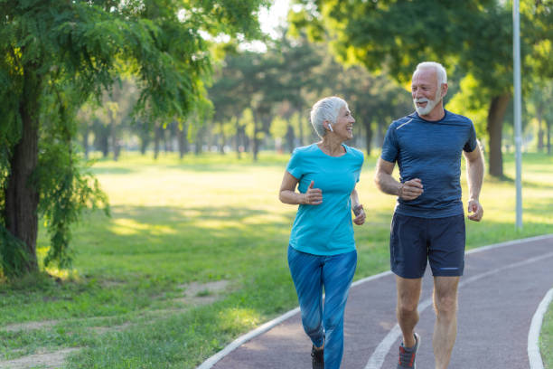 istock Senior friends jogging together 1494565699