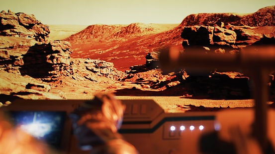 Astronaut inside a Mars rover. Exploring the red planet's rocky surface and conducting research for future of the humanity