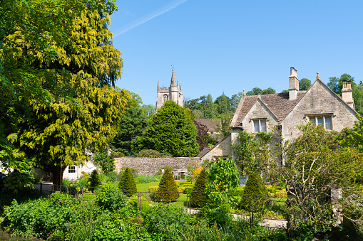 View of village and church Castle Combe village Wiltshire England UK