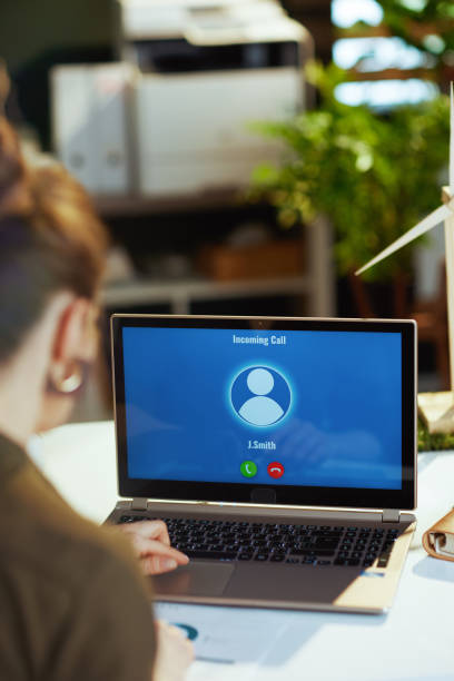 istock Seen from behind modern female with laptop having video chat 1494568738