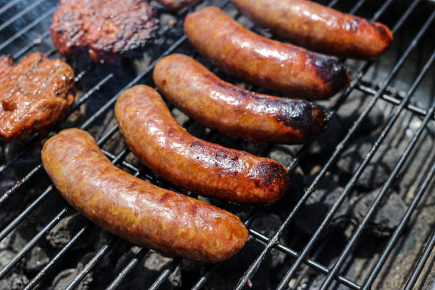 istock Pork sausage and hamburger on a charcoal grill 1494569075